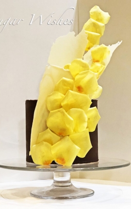 chocolate ganache, white chocolate sculpture, rose petals, yellow roses